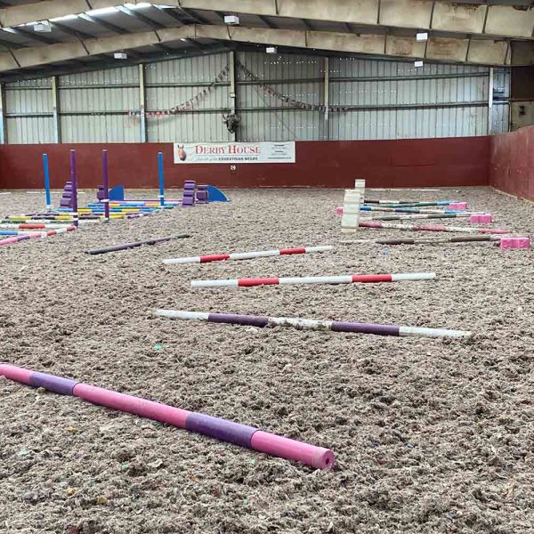 Provanston indoor arena with pole exercises set up